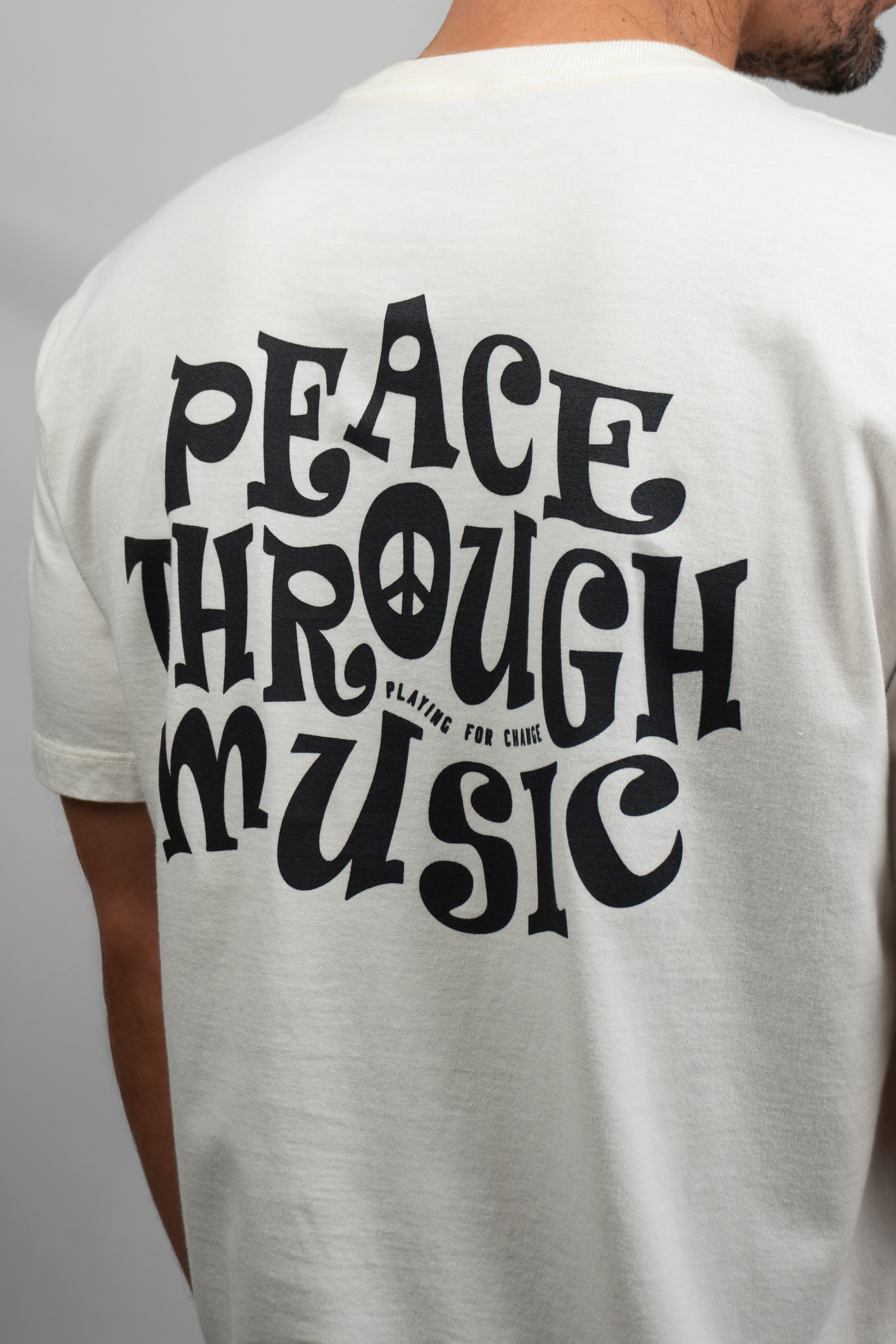 CAMISETA PEACE TROUGHT MUSIC OFF WHITE